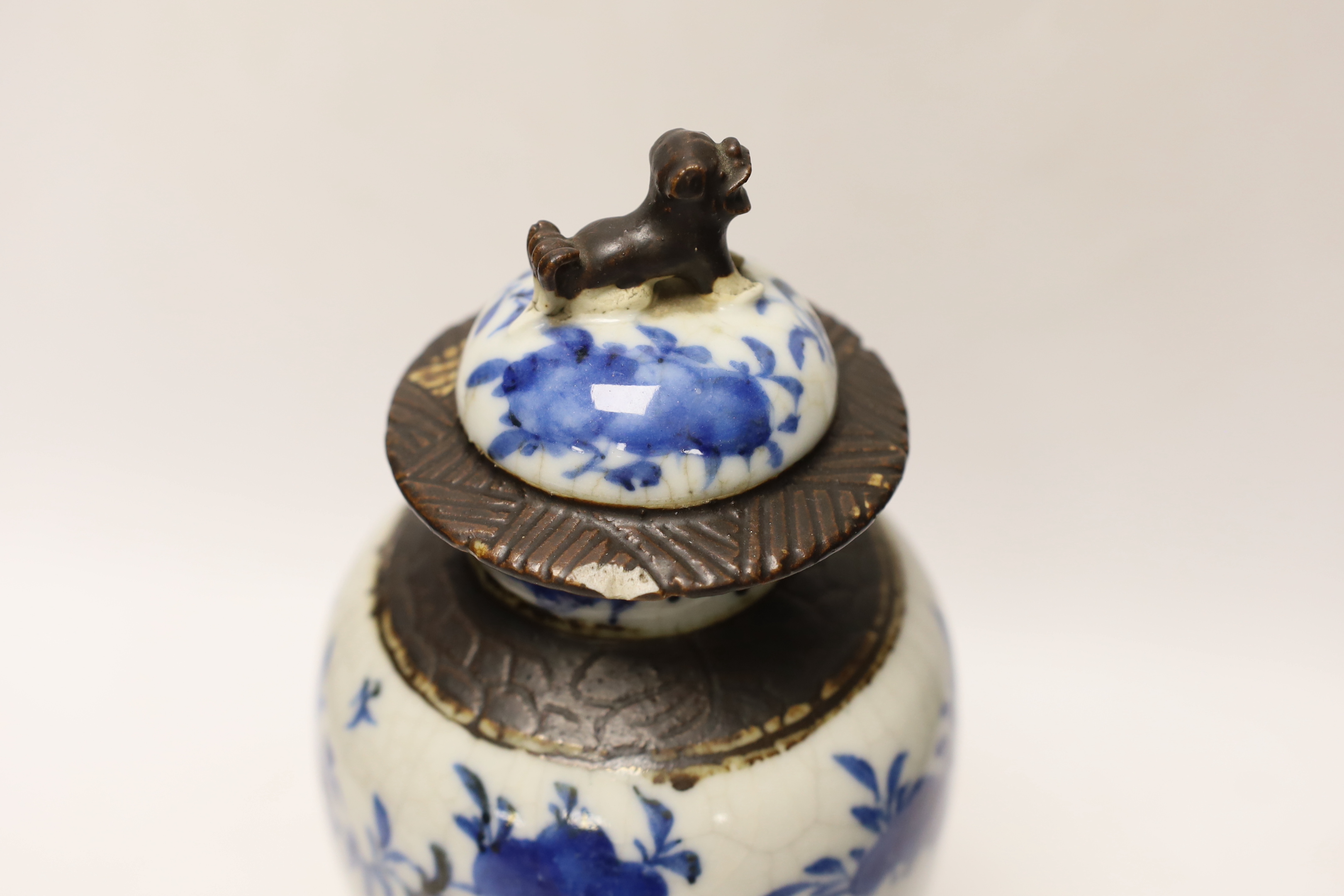 A late 19th century Chinese crackle glaze vase and cover, 30cm